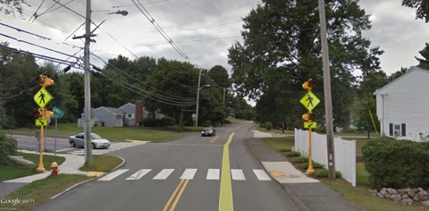 This figure is an image showing a crosswalk and flashing sign near West Memorial School that was constructed using SRTS funds.